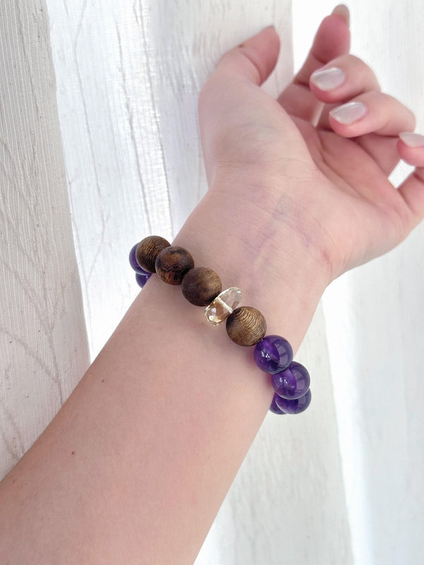 Natural amethyst bracelet with hand-rolled sandalwood incense bead