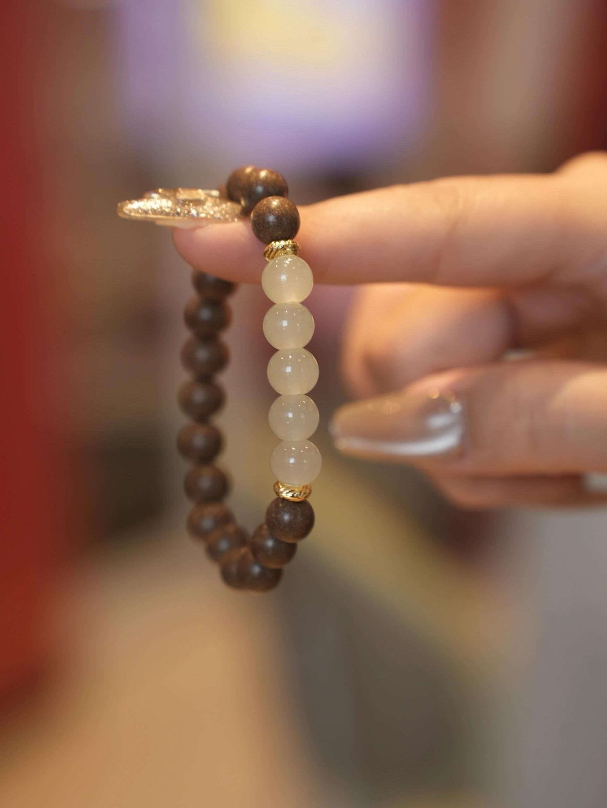 Green aventurine luck bracelet worn on wrist