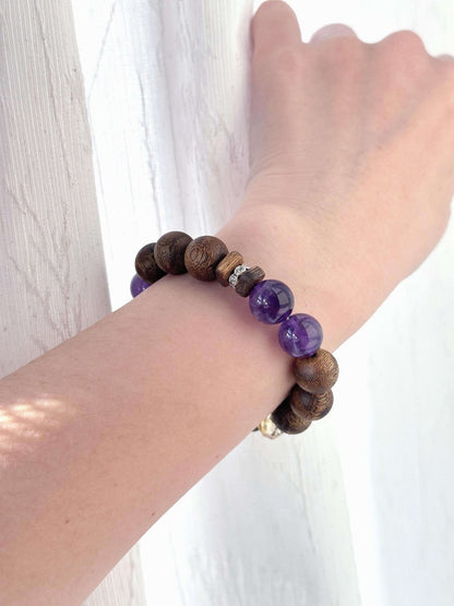 Amethyst bracelet worn on wrist with incense bead