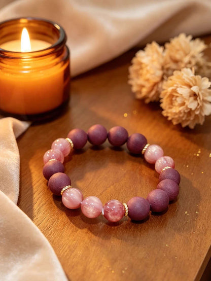 Rose quartz love bracelet worn on wrist