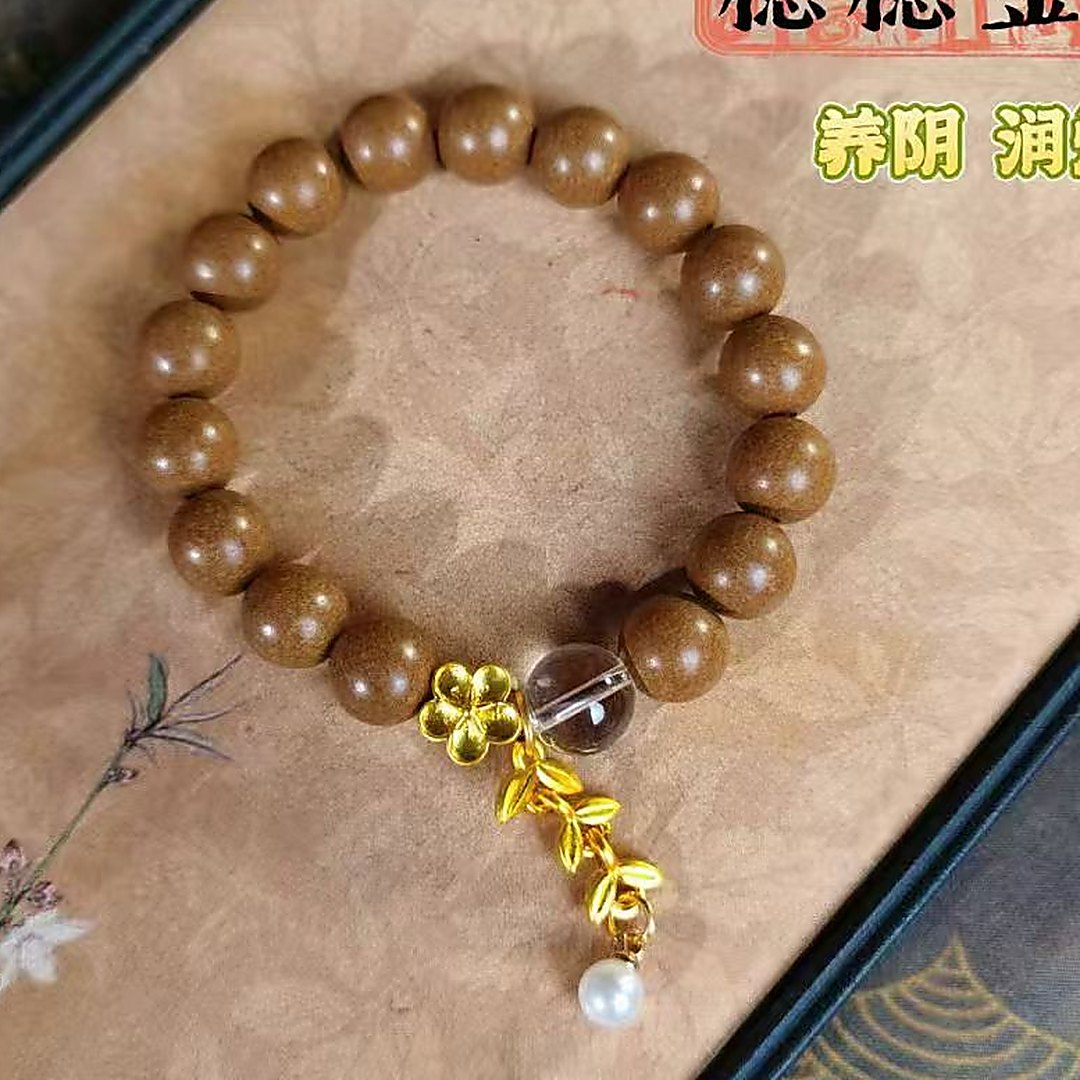 Osmanthus 'Sui Sui Jin Gui' 10mm Bracelet - natural hand-rolled incense bead bracelet detail