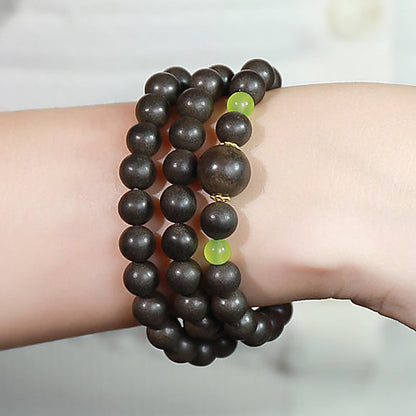 Qing Shen Xiang Olive-Spacer Triple-Row 70-Bead Bracelet - natural hand-rolled incense bead bracelet detail